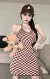 Stylish Black - and - White Checkered Dress Paired with Logo Cap