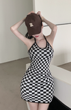 Stylish Black - and - White Checkered Dress Paired with Logo Cap