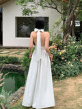 Elegant White Striped Halter Neck Maxi Dress with Front Bow