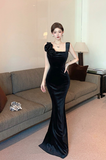 Elegant Black Velvet Evening Gown with Flower Accen