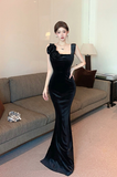 Elegant Black Velvet Evening Gown with Flower Accen