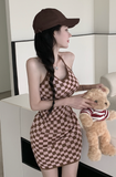 Stylish Black - and - White Checkered Dress Paired with Logo Cap