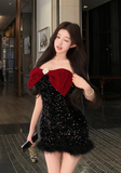 Stylish Sparkling Black Mini Dress with Plush Trim and Bow