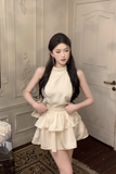 Charming Sleeveless Halter Dress in Cream with Ruffled Skirt