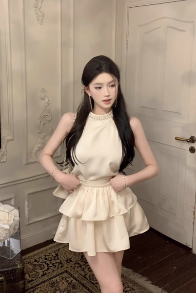 Charming Sleeveless Halter Dress in Cream with Ruffled Skirt