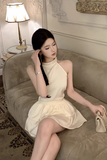 Charming Sleeveless Halter Dress in Cream with Ruffled Skirt