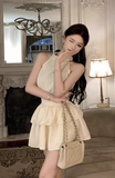 Charming Sleeveless Halter Dress in Cream with Ruffled Skirt