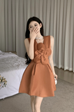 Charming Sleeveless Dress in Rust Color with Large Bow Detail
