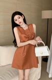 Charming Sleeveless Dress in Rust Color with Large Bow Detail