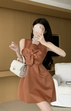 Charming Sleeveless Dress in Rust Color with Large Bow Detail