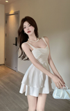 Elegant Ivory Sling Dress with Pleated Bodice and Asymmetric Hem