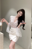 Elegant White Lace Top with Bell Sleeves and Wrap Skirt