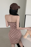 Stylish Black - and - White Checkered Dress Paired with Logo Cap