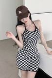 Stylish Black - and - White Checkered Dress Paired with Logo Cap