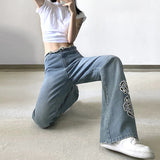 EMBROIDERED FLOWER RAW EDGES JEANS